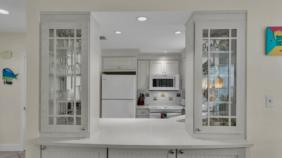 Kitchen or kitchenette, dishwasher, furniture, microwave, oven