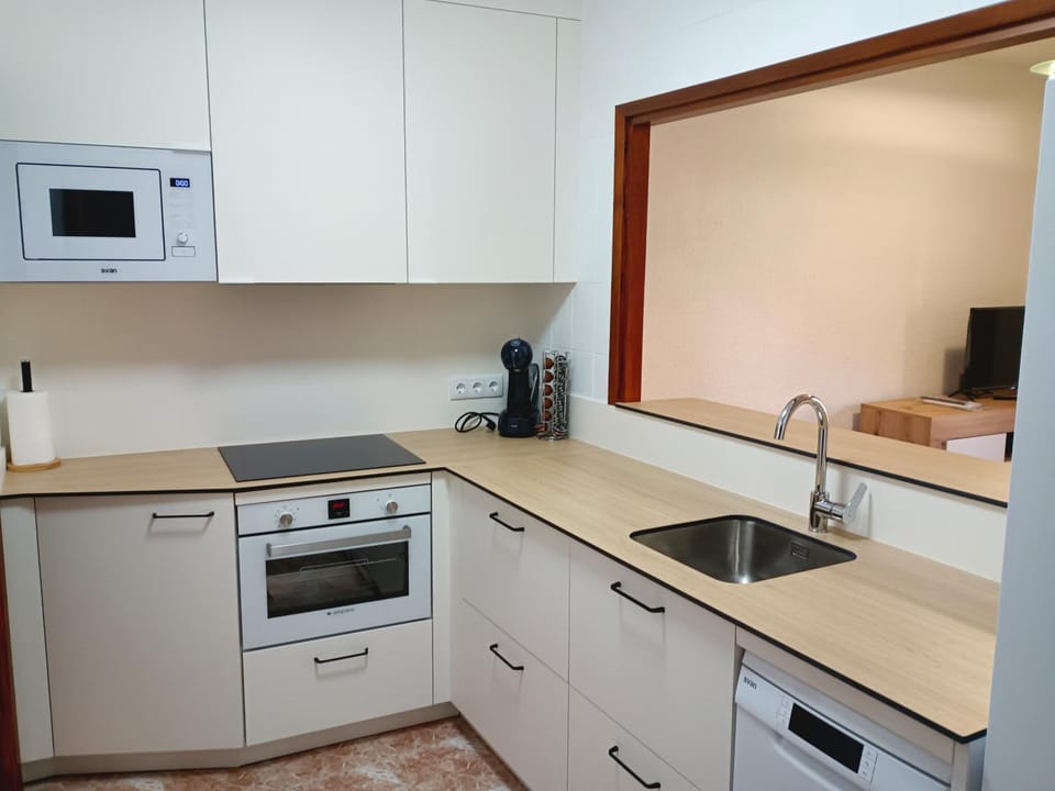 Kitchen or kitchenette, dishwasher, oven, stove, toaster