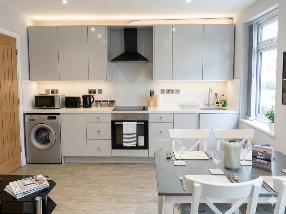 Dining area, microwave, oven, stove, washing machine, kitchen