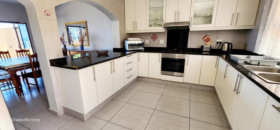 Kitchen or kitchenette, oven, stove, toaster