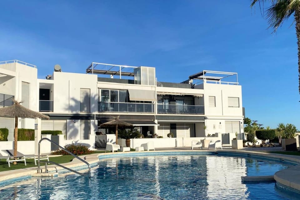 Property building, Pool view, Swimming pool, sunbed