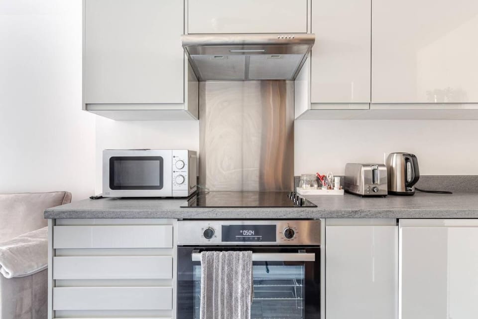 Kitchen or kitchenette, Decorative detail, Seating area, microwave, oven, stove, toaster, towels, washing machine, kitchen