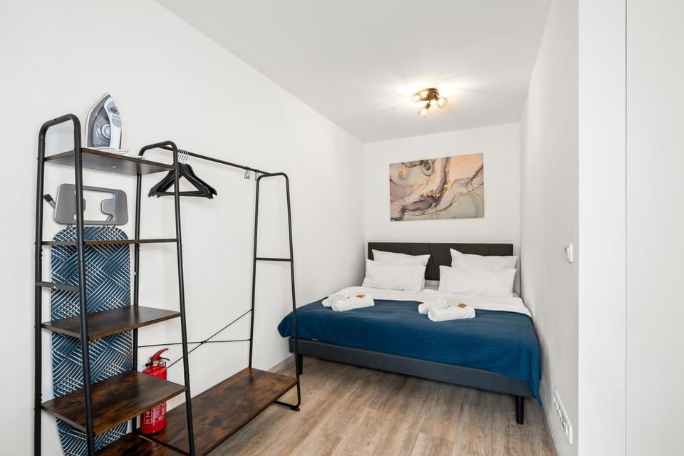 Bed, towels, wardrobe