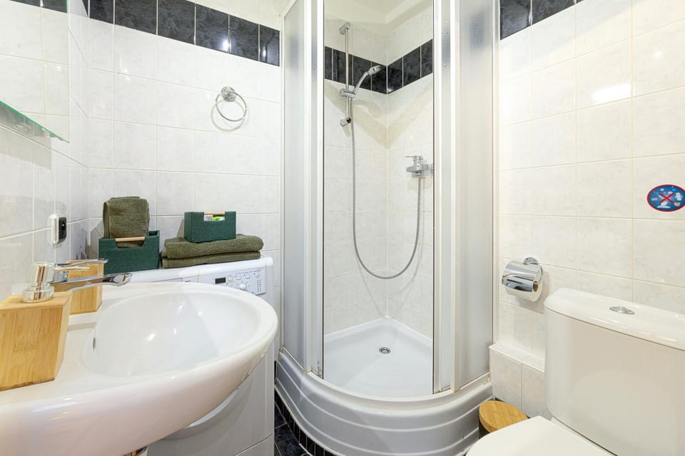 Shower, Toilet, Bathroom, hair dryier, towels