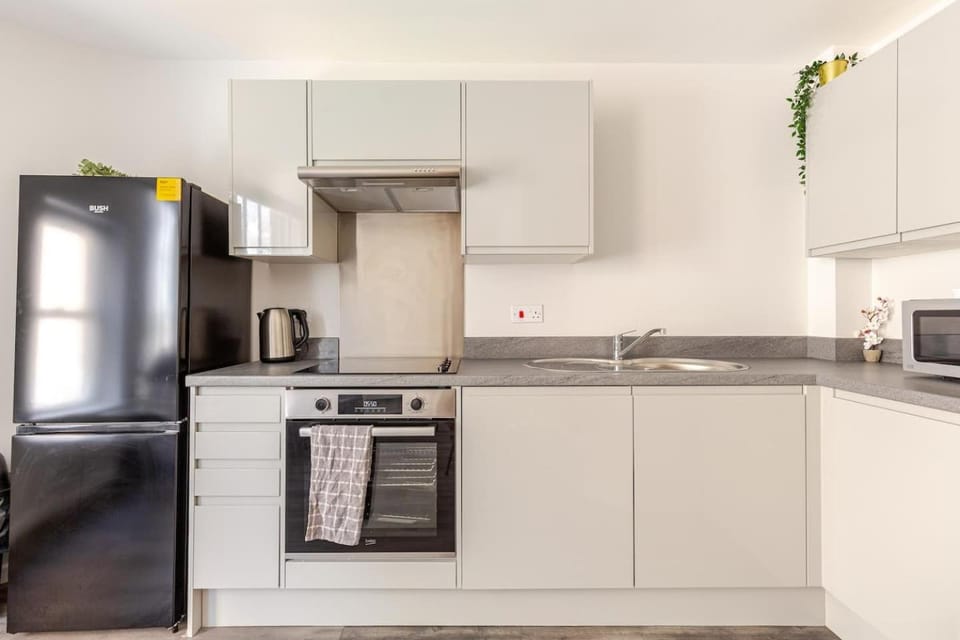 Kitchen or kitchenette, Decorative detail, microwave, oven, stove, toaster, towels, washing machine, kitchen