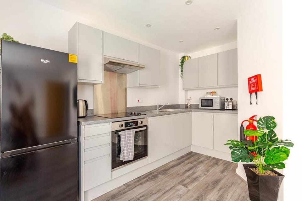 Kitchen or kitchenette, Decorative detail, microwave, oven, stove, toaster, towels, washing machine, kitchen