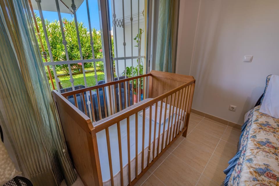 Photo of the whole room, cot