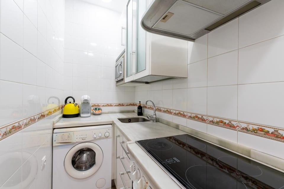 Kitchen or kitchenette, washing machine