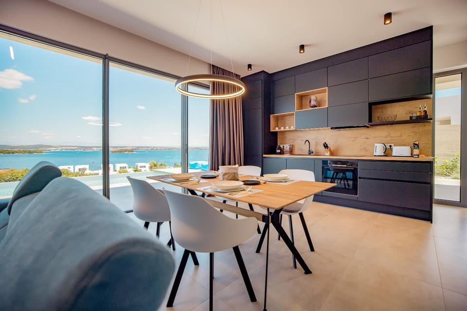 Kitchen or kitchenette, Seating area, Dining area, Sea view