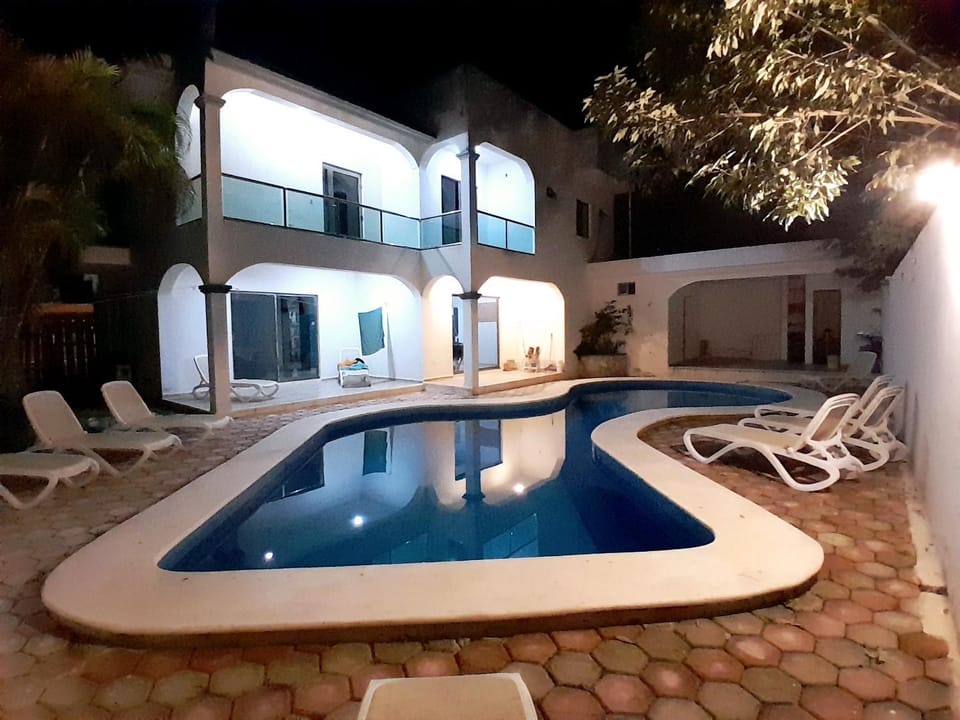Property building, Patio, Pool view, Swimming pool, sunbed