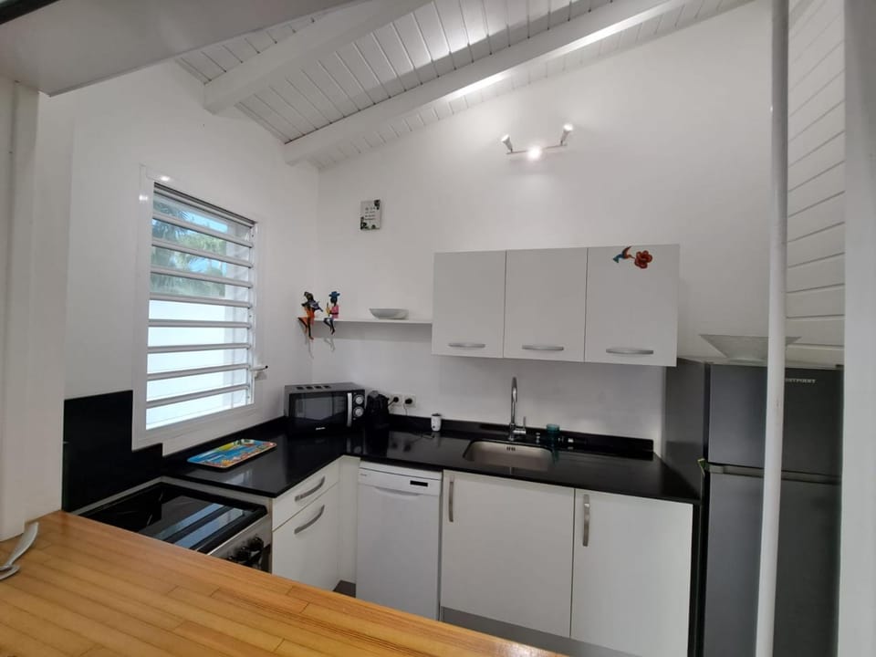 Kitchen or kitchenette, dishwasher, oven, stove