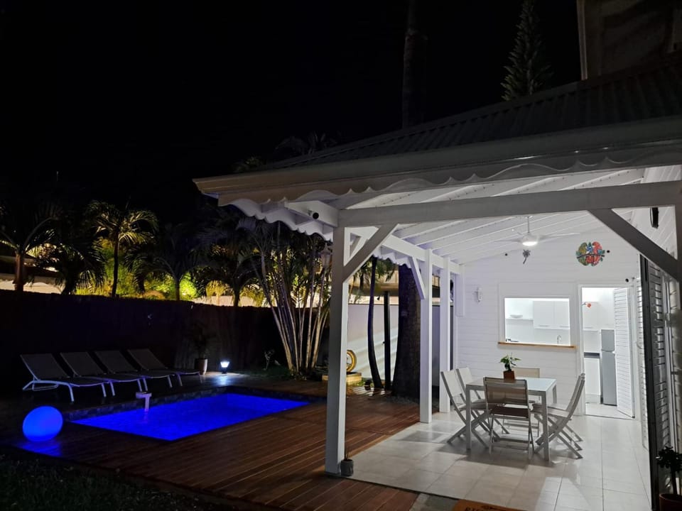 Property building, Night, Balcony/Terrace, Dining area, Pool view, Swimming pool, sunbed
