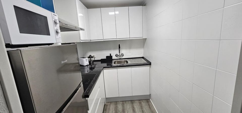 Kitchen or kitchenette, stove, toaster