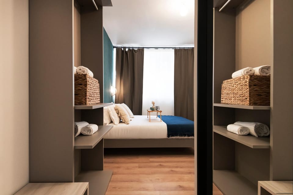 Bed, towels, wardrobe