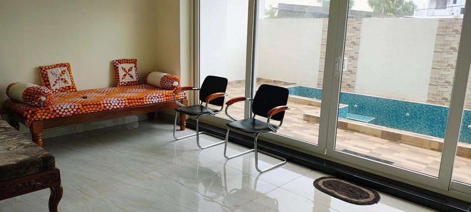 Living room, Seating area, Pool view, Swimming pool