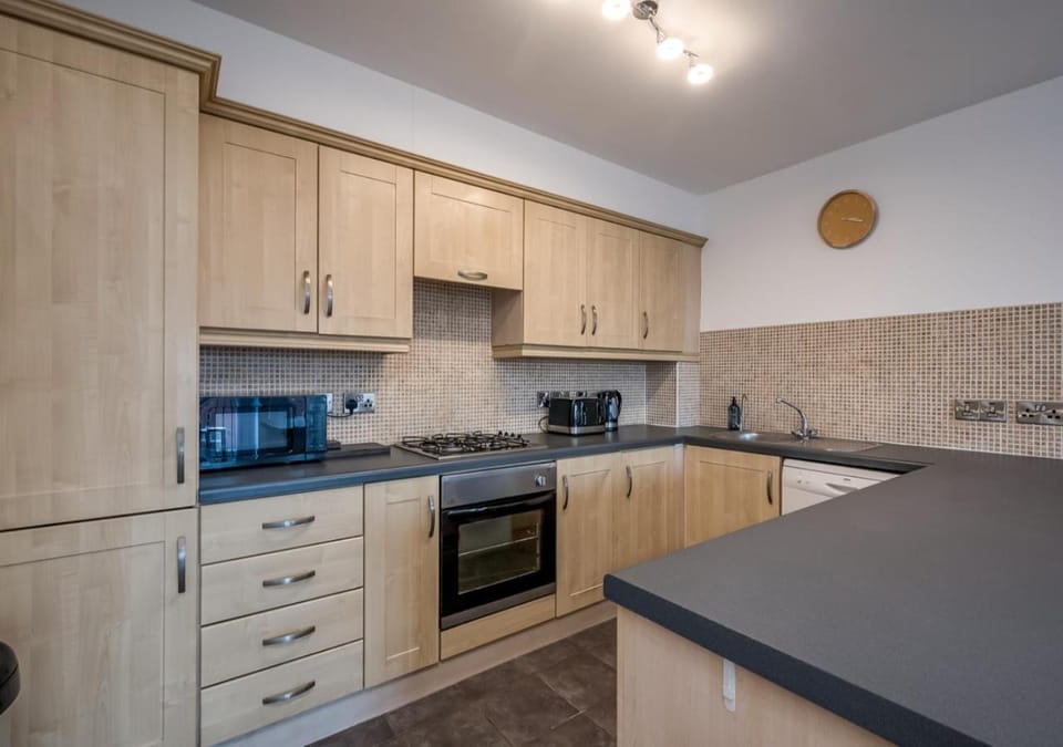 Kitchen or kitchenette, dishwasher, microwave, toaster