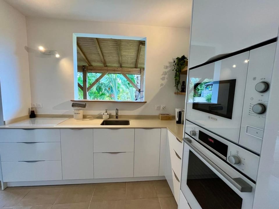 Kitchen or kitchenette, dishwasher, oven, stove
