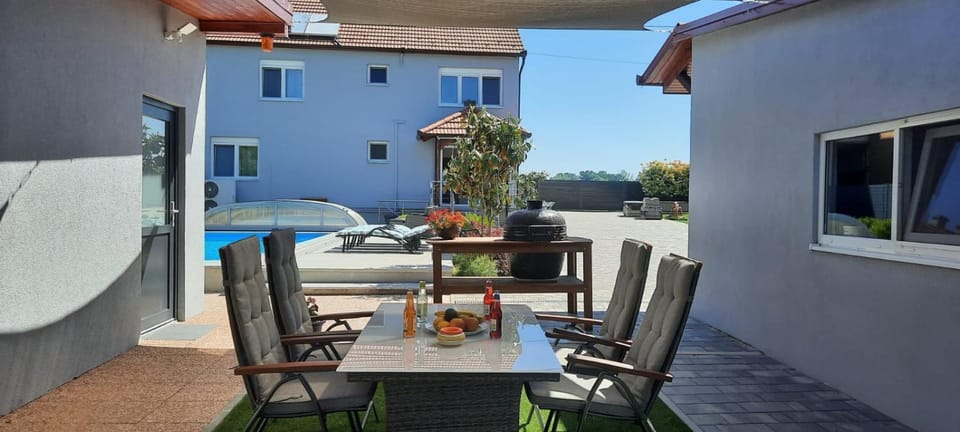 Property building, Patio, Day, Seating area, Pool view