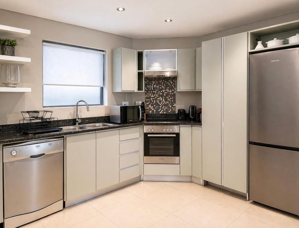 Kitchen or kitchenette, dishwasher, microwave, oven, stove, toaster