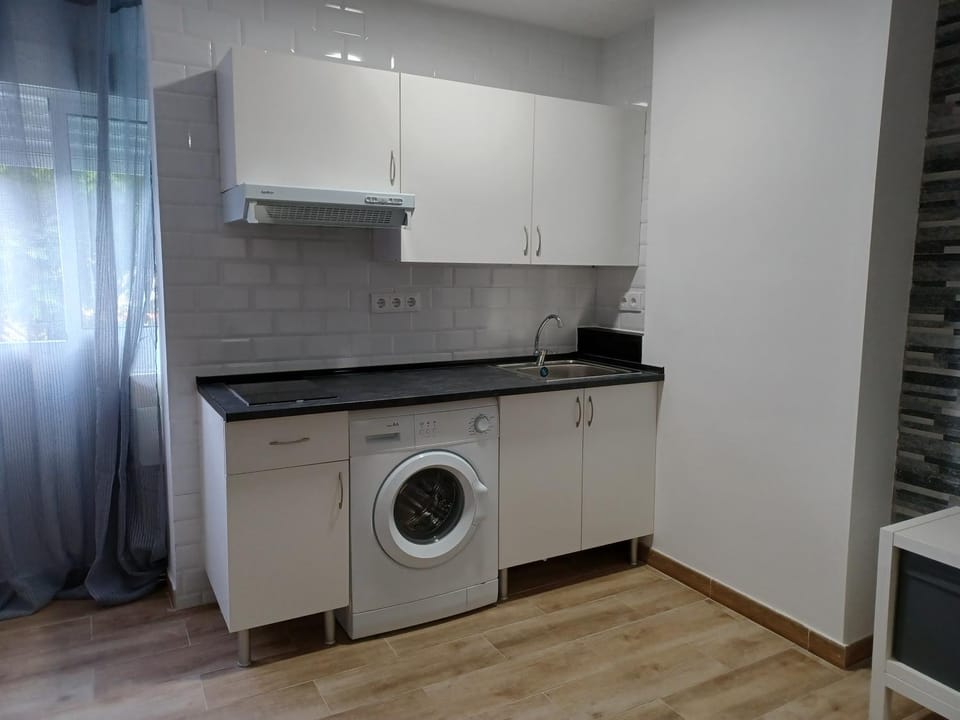 Kitchen or kitchenette, stove, washing machine