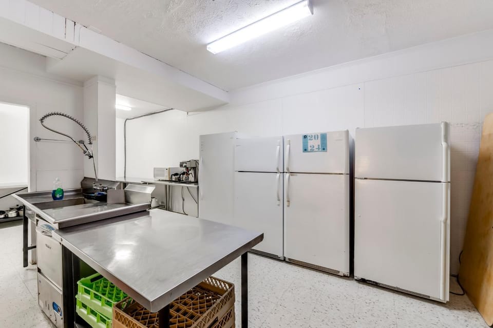 Kitchen or kitchenette, dishwasher, oven, stove