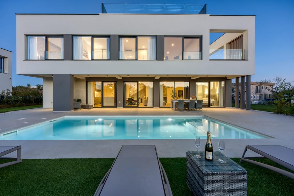 Property building, Patio, Night, Pool view, Swimming pool, sunbed