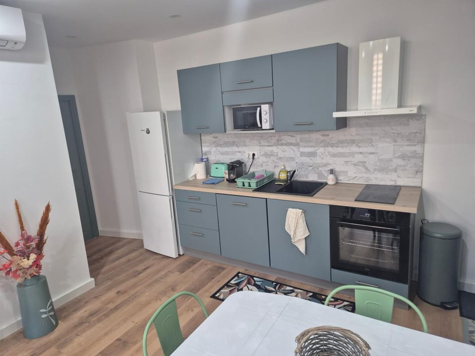 Kitchen or kitchenette, oven, stove, toaster