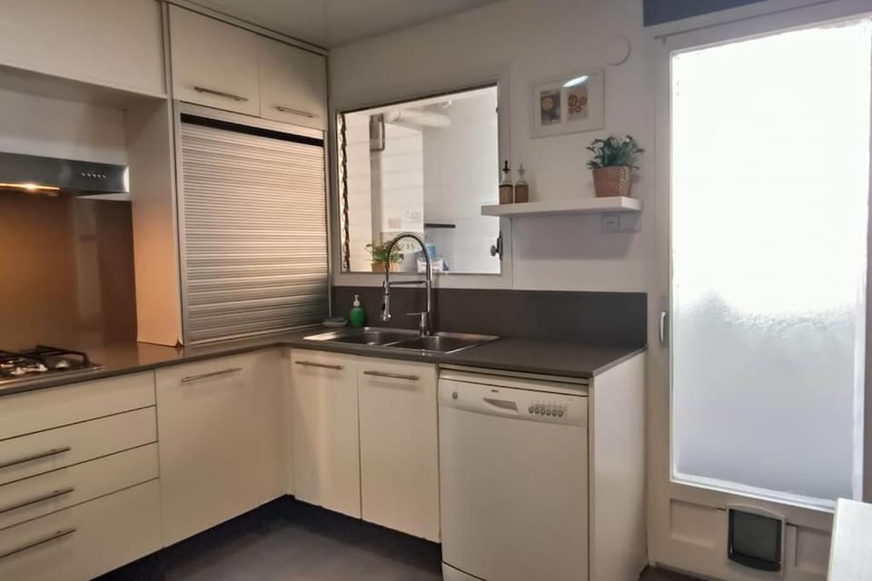 Kitchen or kitchenette, dishwasher, oven, stove