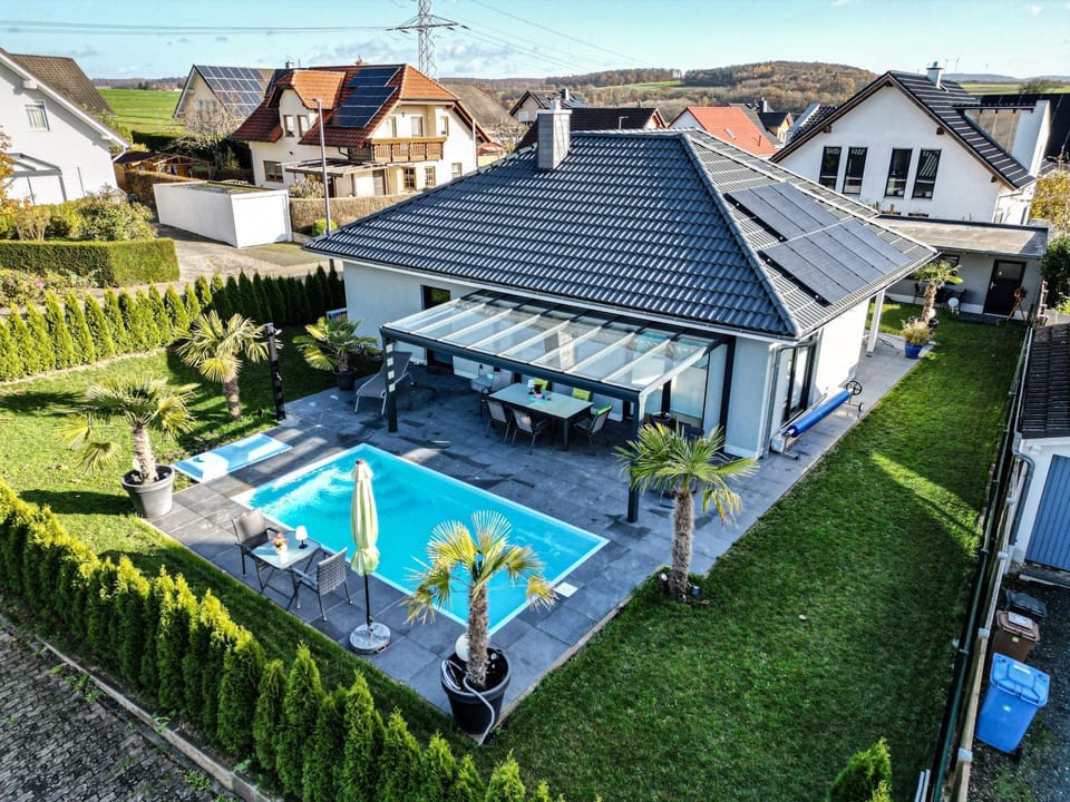 Property building, Living room, Swimming pool