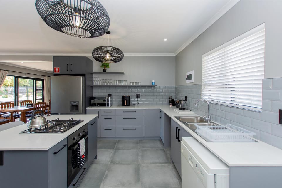 Kitchen or kitchenette, dishwasher, oven, stove, toaster