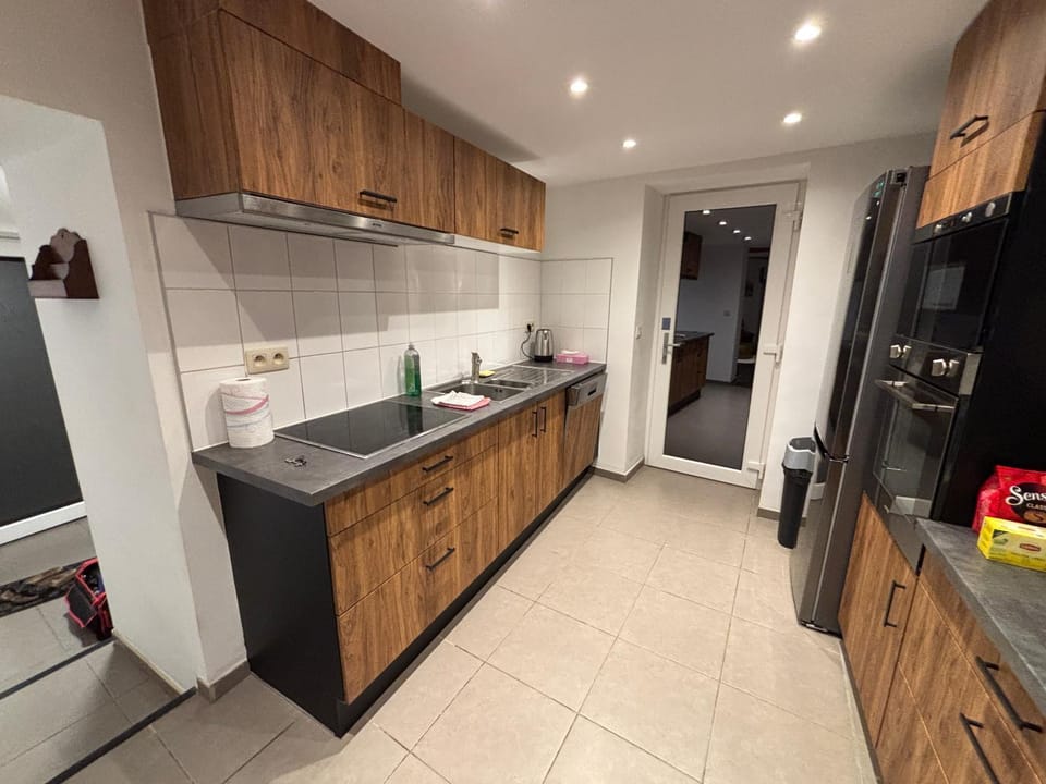 Kitchen or kitchenette, dishwasher, oven, stove