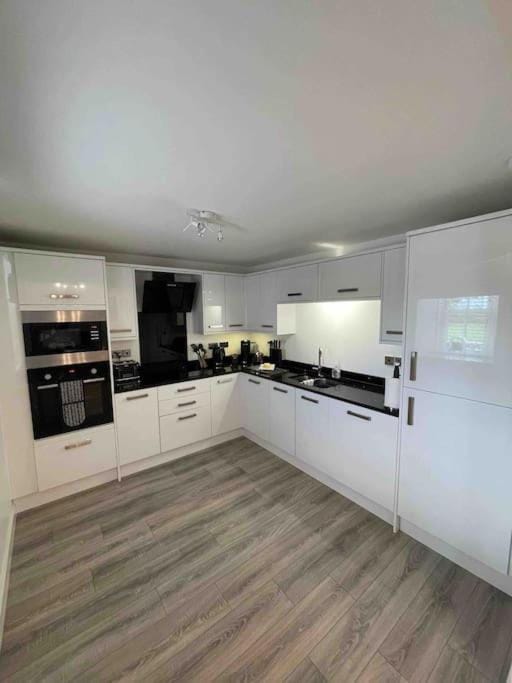 Kitchen or kitchenette, dishwasher, oven, stove