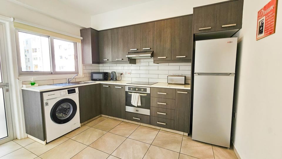 Kitchen or kitchenette, oven, stove, washing machine, kitchen