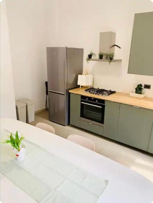 Kitchen or kitchenette, dishwasher, oven, stove