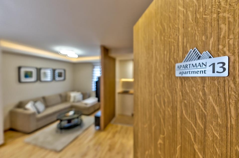 Property logo or sign, Living room, Seating area, Text overlay