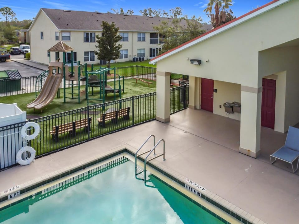 Property building, Patio, Children play ground, Pool view, Swimming pool, sunbed