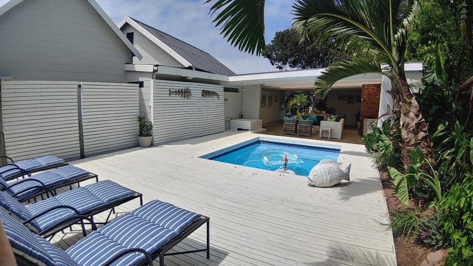Property building, Patio, Pool view, Swimming pool, sunbed