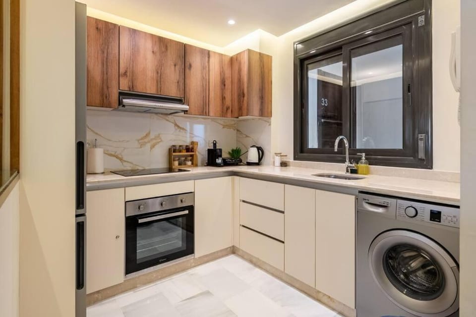 Kitchen or kitchenette, oven, stove, washing machine