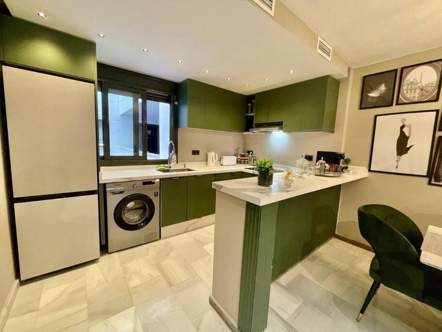 Kitchen or kitchenette, oven, stove, washing machine