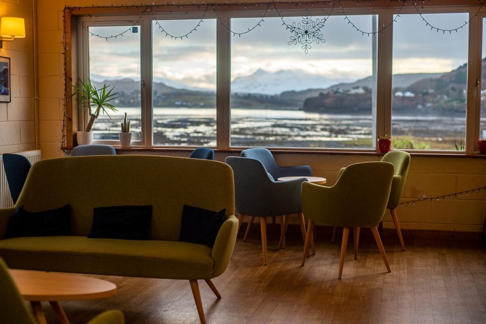 Communal lounge/ TV room, Natural landscape, Living room, Seating area, Lake view, Mountain view