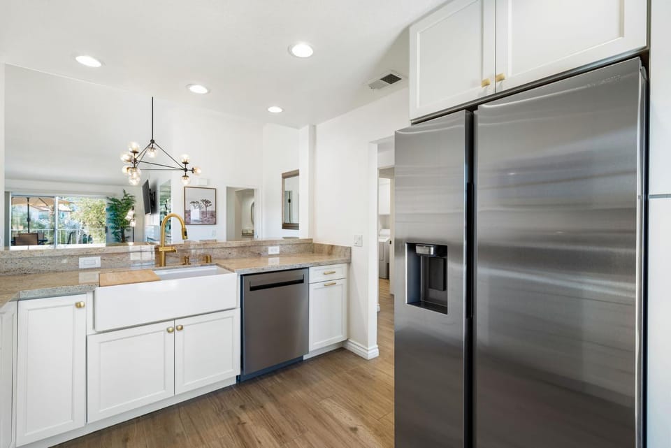 Kitchen or kitchenette, dishwasher, oven, stove