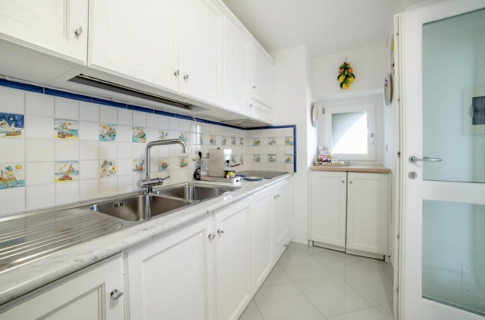 Kitchen or kitchenette, dishwasher, stove, washing machine