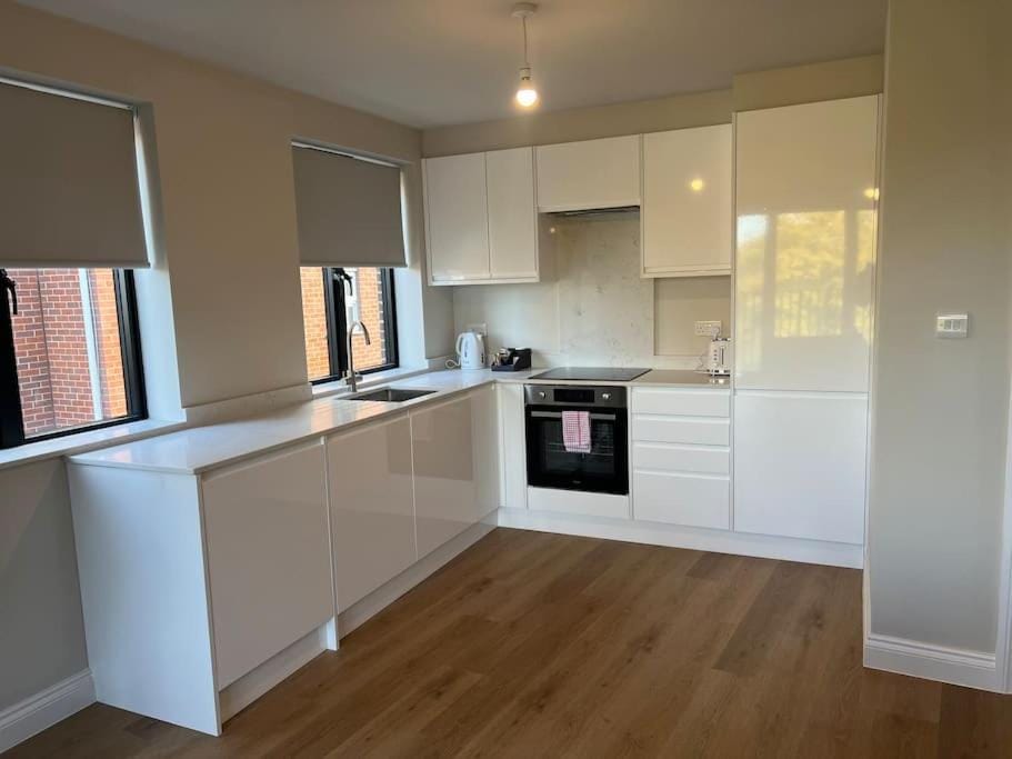 Kitchen or kitchenette, dishwasher, oven, stove, toaster