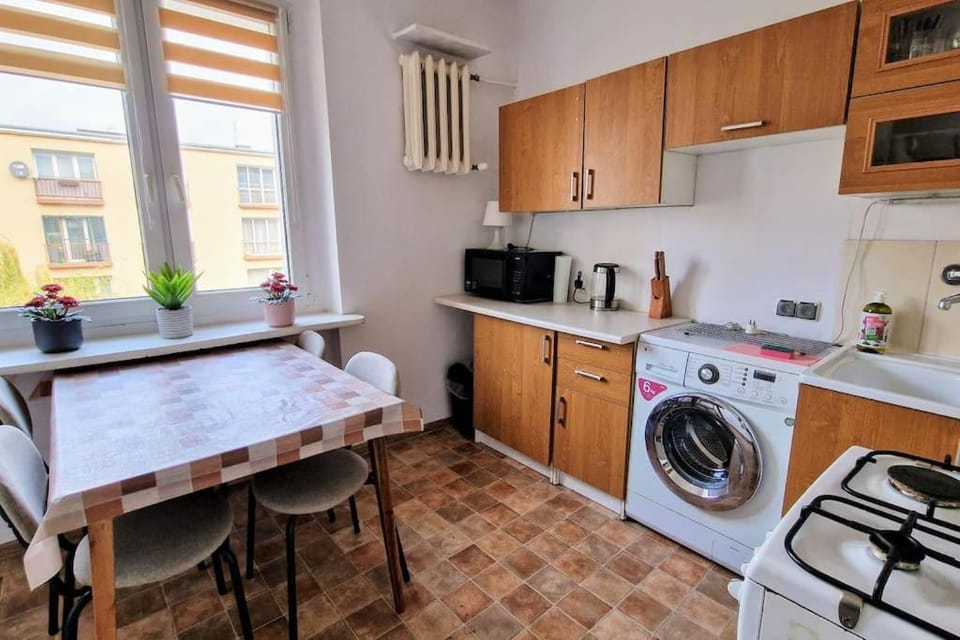 Kitchen or kitchenette, microwave, oven, washing machine