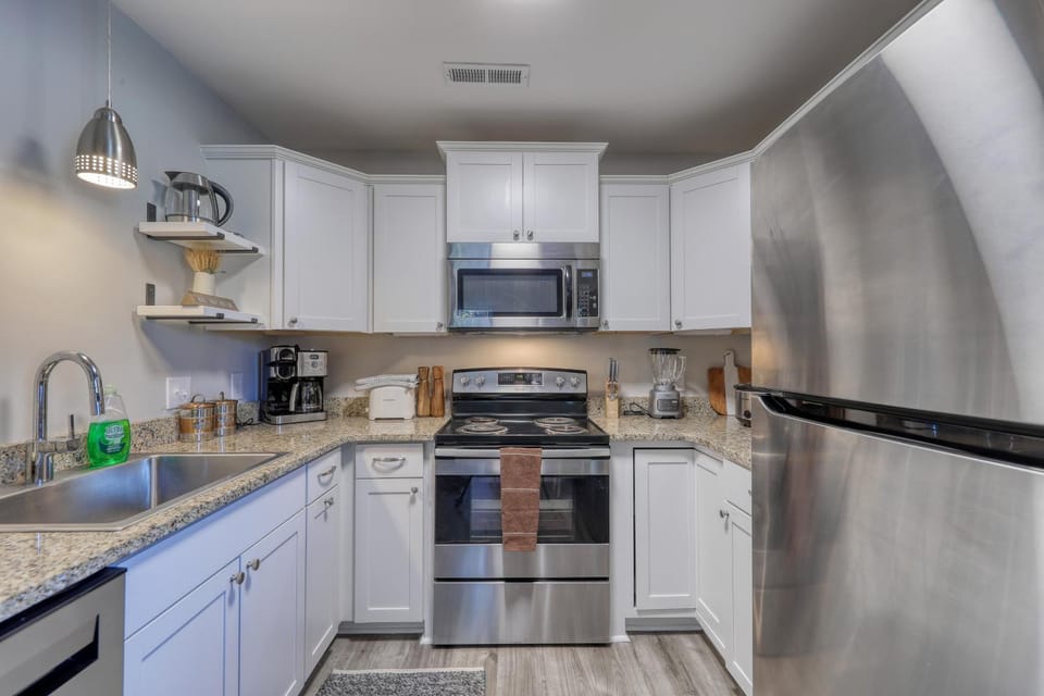 Kitchen or kitchenette, dishwasher, oven, stove, toaster
