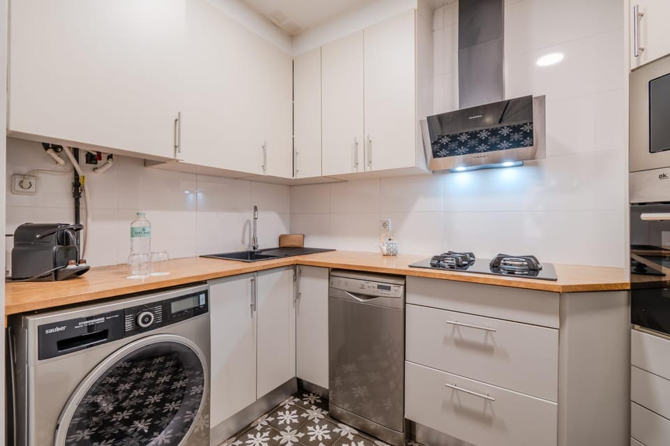 Kitchen or kitchenette, dishwasher, stove, washing machine