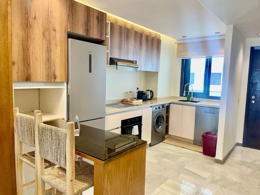 Kitchen or kitchenette, dishwasher, oven, stove, washing machine