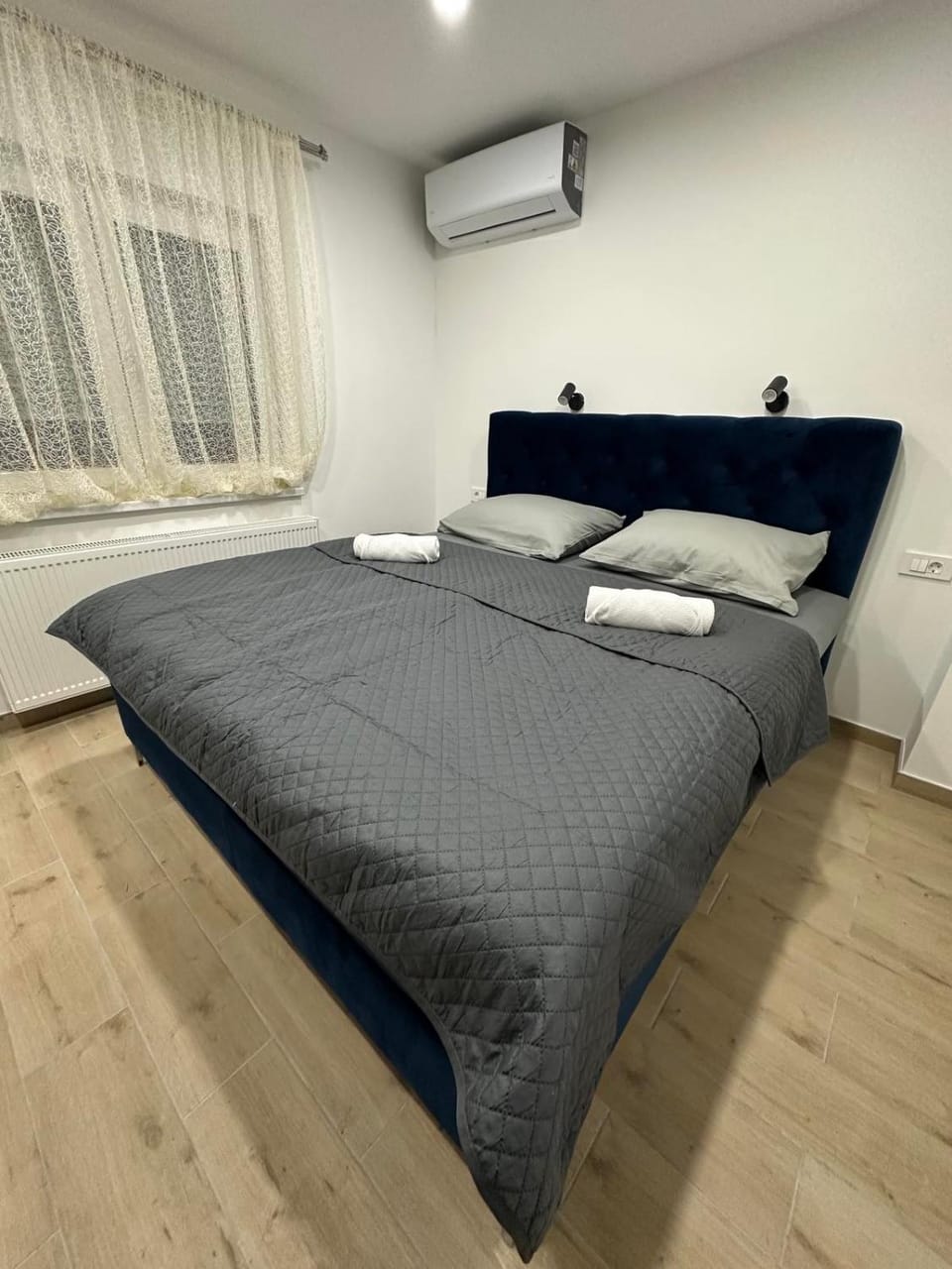 Bed, Photo of the whole room, Bedroom, towels, air conditioner
