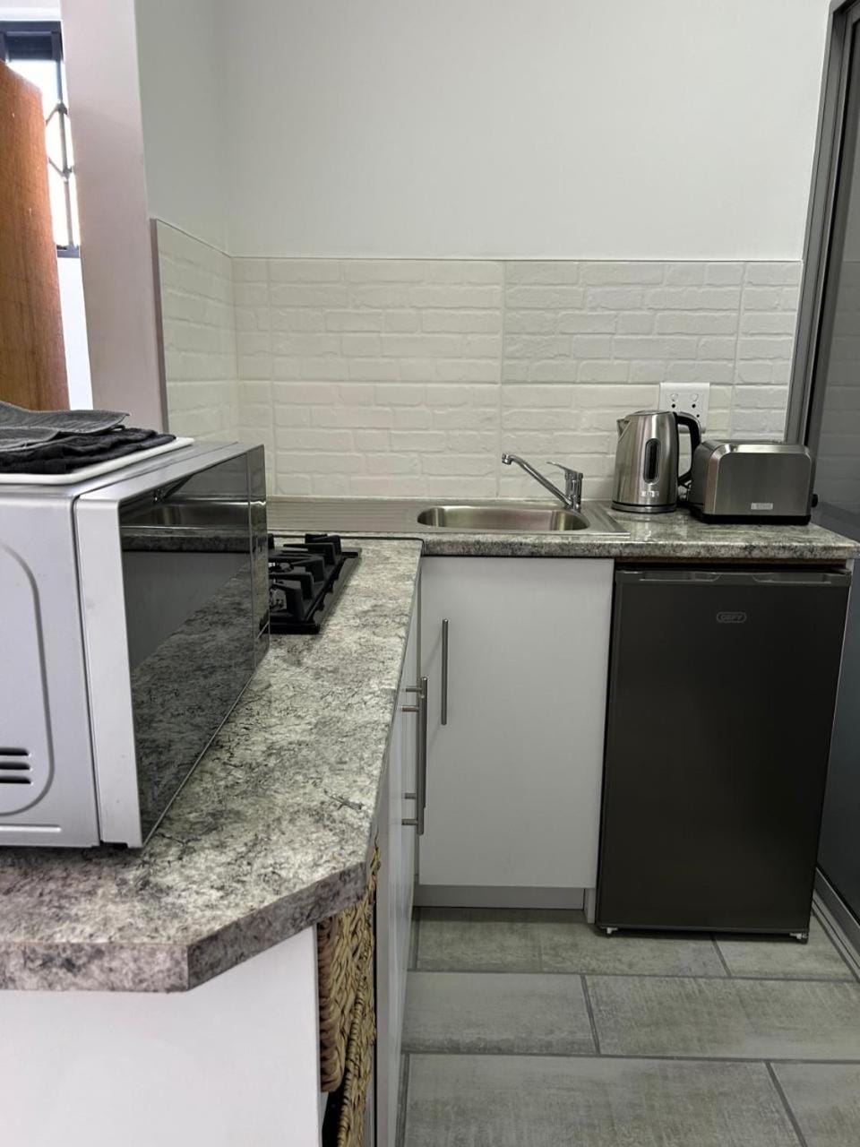 Kitchen or kitchenette, microwave, toaster