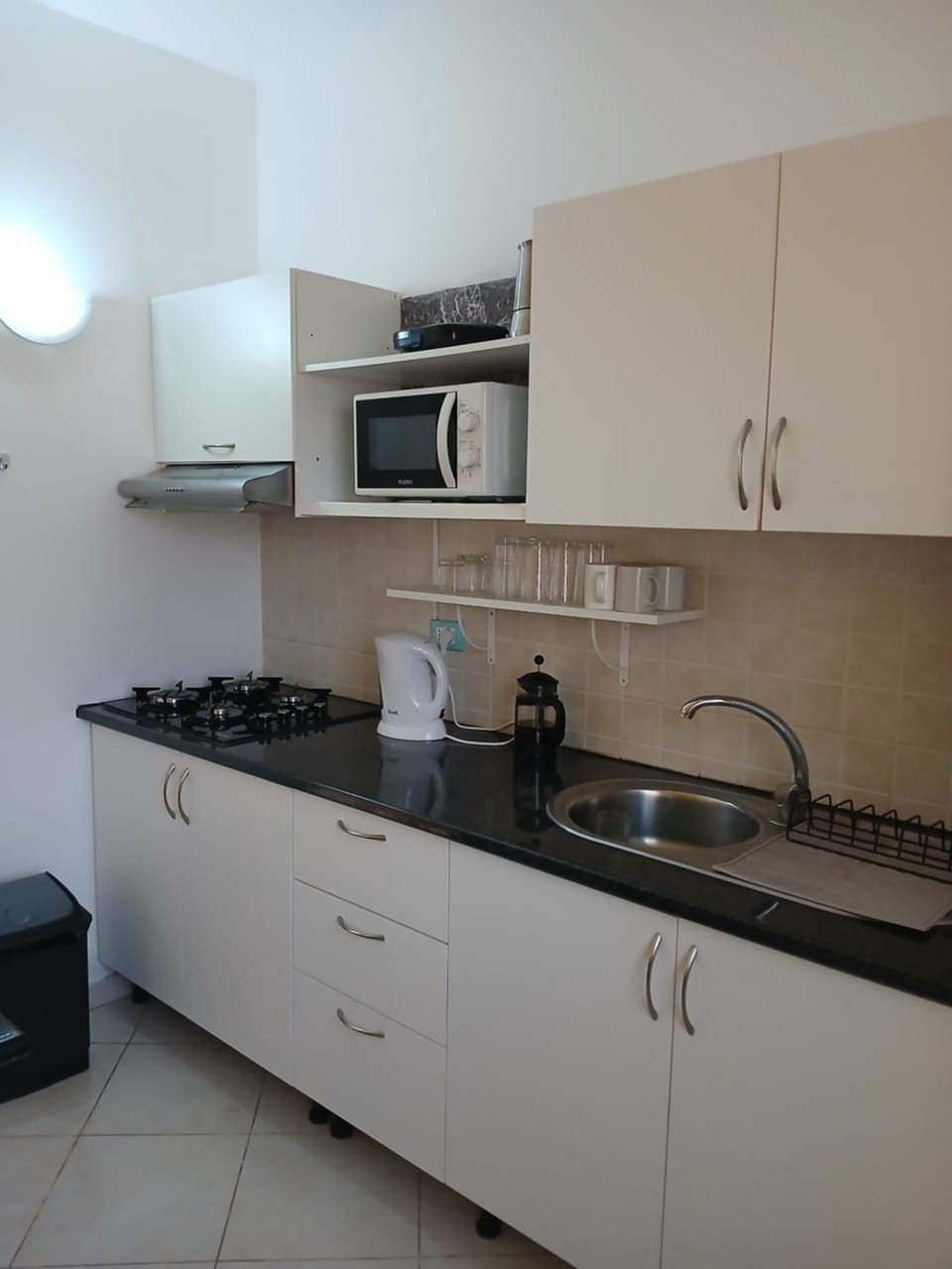 Kitchen or kitchenette, stove, toaster